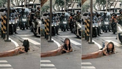 女子从菲律宾闹市排水道爬出,画面惊悚像恐怖电影